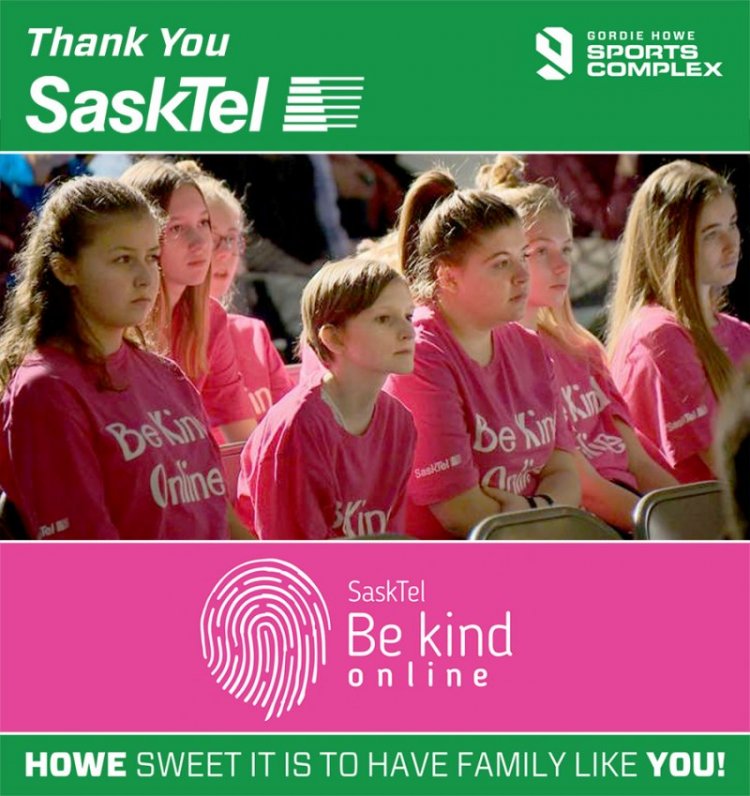 Photo of young girls in a classroom wearing "SaskTel Be Kind Online" T-shirts